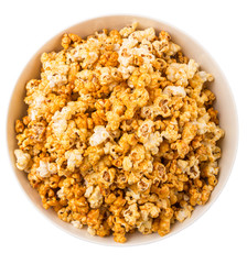 Caramel popcorn in white bowl over white background