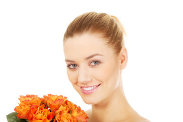 Fototapeta premium Smiling woman with fresh roses.