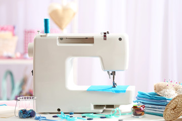 Sewing machine on table in workshop