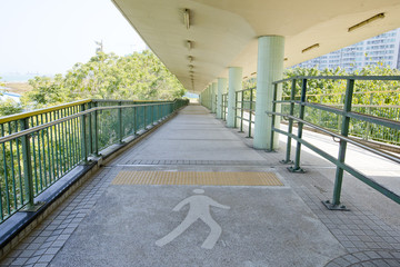 walkway with a metal handrail.