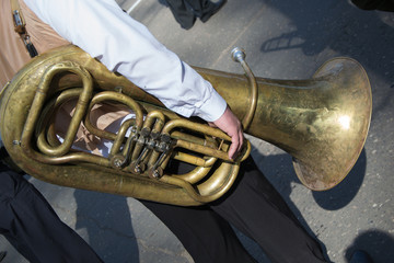 A musician from a brass band with a tuba