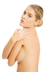 Obraz na płótnie Canvas Topless woman covering her breast