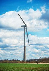 Fototapeta premium View of Wind turbine over blue sky.