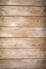 Fototapeta premium Brown textured wooden board background. Vertical.