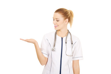 Medical doctor woman with open hand.