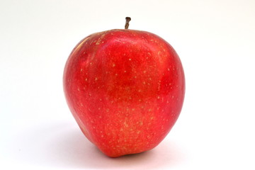 A red apple on a white background is grown without chemicals