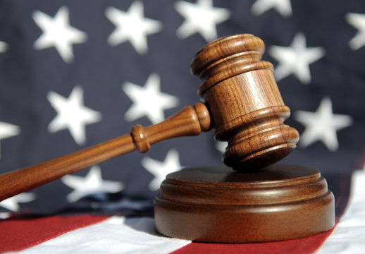 Order in the court - wooden gavel and flag