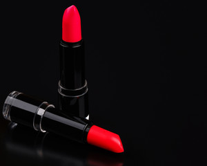 Colorful lipsticks on black
