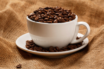 Cup filled with coffee beans