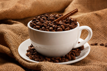 Cup filled with coffee beans