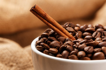Cup filled with coffee beans