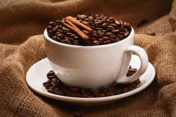 Cup filled with coffee beans