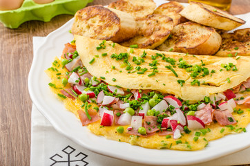 Omelette with spring vegetables and bacon