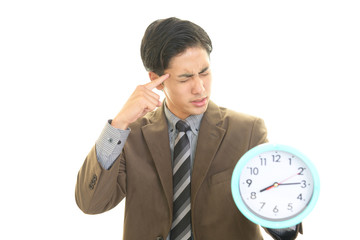 困った表情のビジネスマン