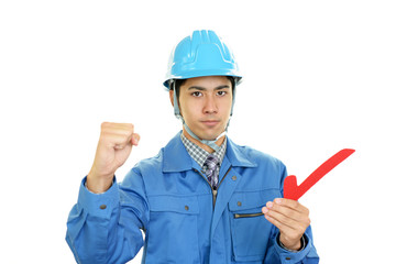 ガッツポーズの労働者