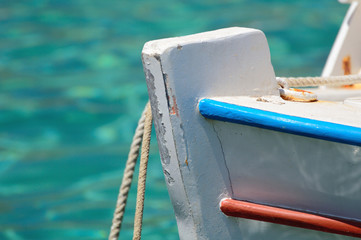 Traditional colorful greek fishing boat closeup. - 83087116