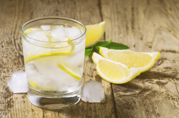 Fresh water with lemon, mint and ice, selective focus