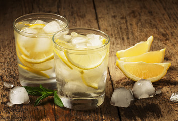 Fresh water with lemon, mint and ice, selective focus