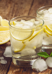 Fresh water with lemon, mint and ice, selective focus