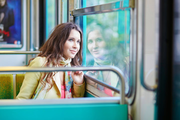 Young beautiful Parisian woman in subway