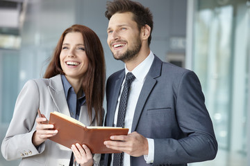 Portrait of two smiling business persons