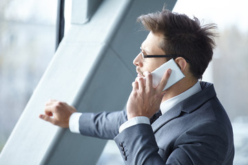 Handsome businessman on the phone