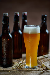 Glass and bottles of beer