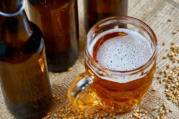 Glass and bottles of beer