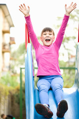 Fototapeta premium Girl is playing on playground