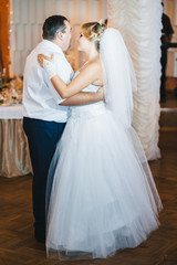 Fototapeta na wymiar beautiful caucasian couple just married and dancing their first
