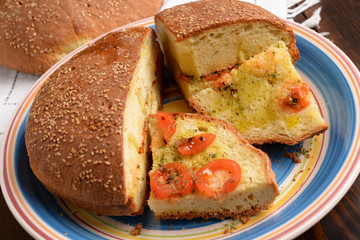 Bread baked in a wood seasoned - Pane cotto a legna condito