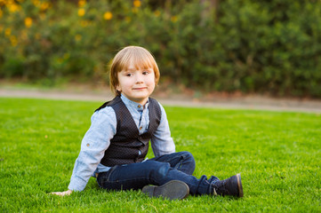 Outdoor portrait of adorable little boy 