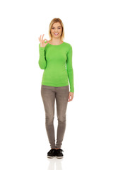 Young woman showing the perfect sign.