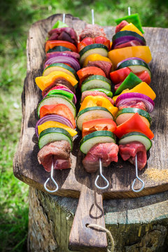 Fresh beef and vegetables with herbs on grill