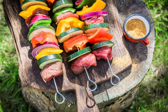 Fresh beef and vegetables with spices on grill