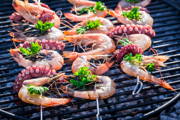 Grilling tasty seafood with lemon and parsley