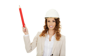 Architect woman pointing up with pencil. 