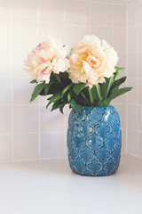 Blue moroccan vase with large white flowers