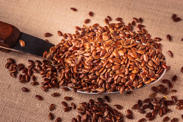 Flax seeds linseed on kitchen spoon