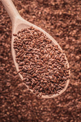 Flax seeds linseed on wooden spoon