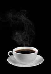 Cup of hot coffee on a black background. Steam.