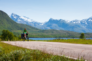 Fototapeta premium Biking in Norway against picturesque landscape