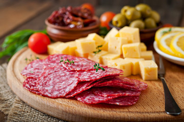 Antipasto catering platter with salami and cheese  - obrazy, fototapety, plakaty