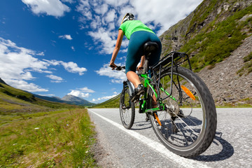 Biking in Norway against picturesque landscape
