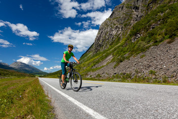 Biking in Norway against picturesque landscape