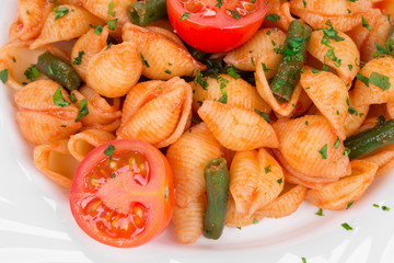 Spaghetti with tomato basil and peas.