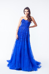 Young woman in a beautiful blue evening dress