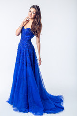 Young woman in a beautiful blue evening dress