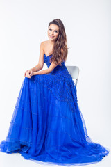 Young woman in a beautiful blue evening dress