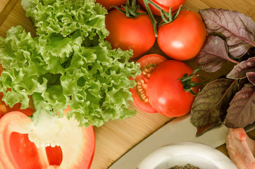 Fresh ripe vegetables and spice on wooden table